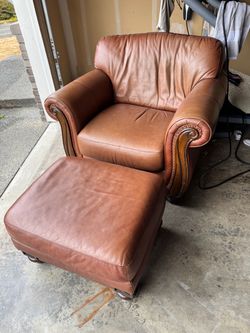 Arm chair with foot stool