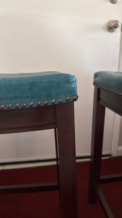 Teal and dark wood bar stools