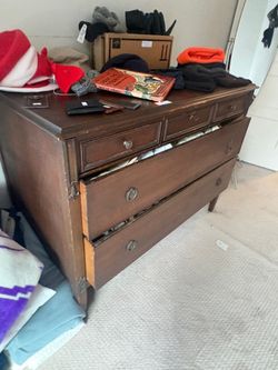 Dark Wood Three-Drawer Dresser with Recessed Panels