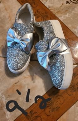 Sparkling   new shoes with a bow