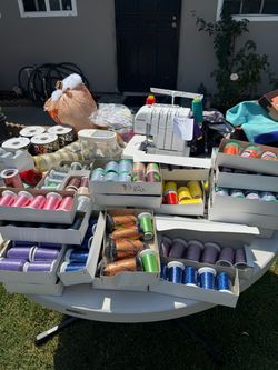 Serger with boxes of thread