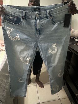True Religion blue jeans with white embroidery