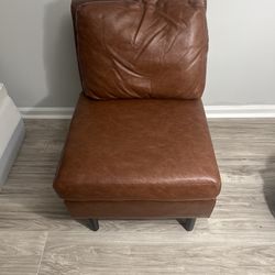 Brown armless accent chair