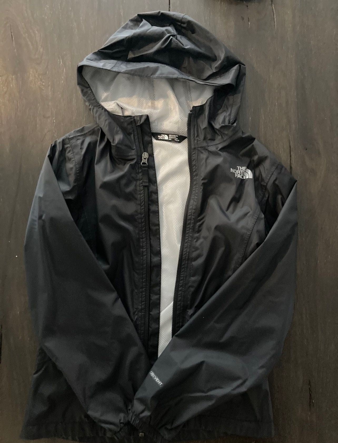 size m (10-12) North face girls rain jacket