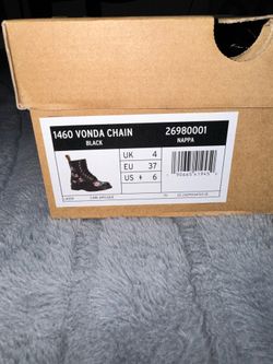 Size 6 women’s black embroidered doc martens