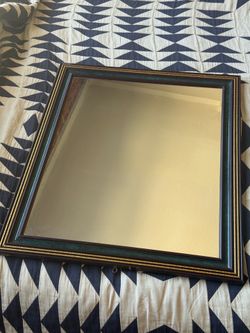 Decorative mirror with wooden frame
