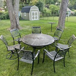 Large Cast Aluminum 10pc Patio Set, Table Is 60” Diameter, 7 Chairs, 2 Of Them Are Swivel, 2 Foot Ottomans, Freshly Painted, Looks Like New 