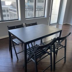 indoor/ outdoor table and 4 foldable chairs