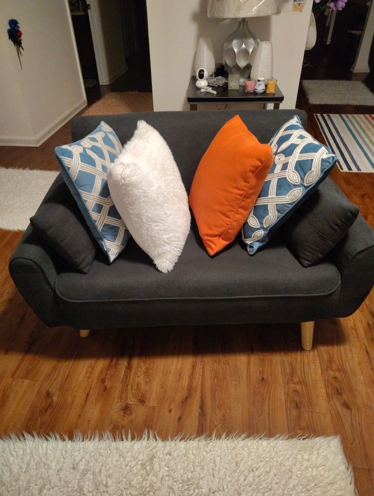 A CUTE BLUE SOFA CAN HOLD UP TO A 300_ 50 POUND PERSON