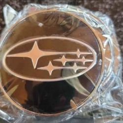 Subaru 2pc black and chrome Center caps.