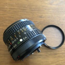 Camera lens 28mm Perfect condition as in picture with filter