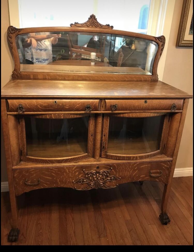 Antique sideboard or buffet. It is a beautiful tiger oak. It has a large drawer on the bottom and two small drawers in the top. There is