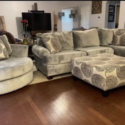 Beautiful, gray, plush sectional with ottoman and swivel chair