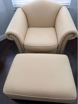 Cream arm chair and ottoman