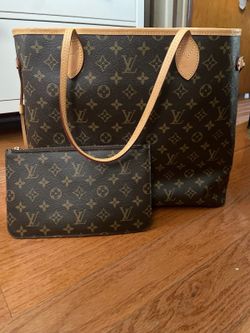 Brown and tan Louis Vuitton Neverfull MM tote bag with brown monogram canvas and beige leather trim #luxury #designer
