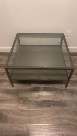 Glass table with storage