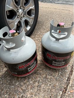 Two propane tanks, full propane