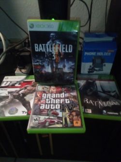 Brand new Xbox games with cell phone holder for a bicycle tables vintage three chairs with plastic on it