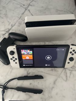 Nintendo Switch OLED White Bundle + 2 Games (Mario Odyssey & Switch Sports)