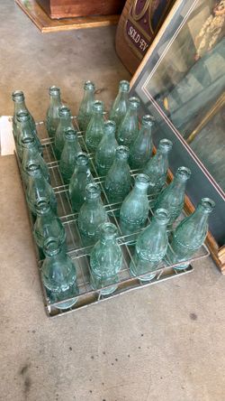 $100 old Coca-Cola bottles and 24 pack tray