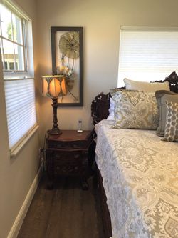 Beautiful king size headboard/footboard (mattress not included), armoire, two night stands, 2 wingback chairs.