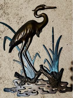 Bras herone sculpture