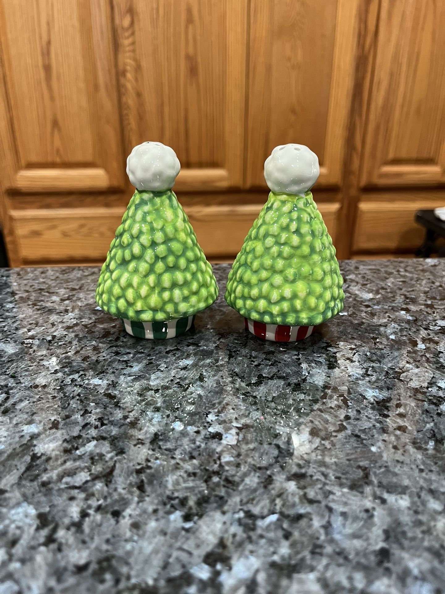 Hand Painted Ceramic Christmas Tree Pair of Salt and Pepper Shakers. Size approximately 3 1/2 inches. Preowned. Has been on display in a cabinet w