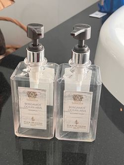Set up 2 empty refillable luxury pump bottles