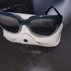 Aquaswiss sunglasses feature a distinctive cat-eye frame design with a teal-to-black gradient finish