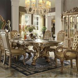 Elegant Dining set table and 6 chairs and led china .Dinning set gold color. retail 6,000