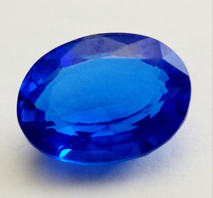 15.02 Ct Loose Clear Blue Zoisite Tanzanite-Like Excellent Oval Cut Gemstone. Dimensions are approximate. The product is a 15.02 Ct loose clear blue Z