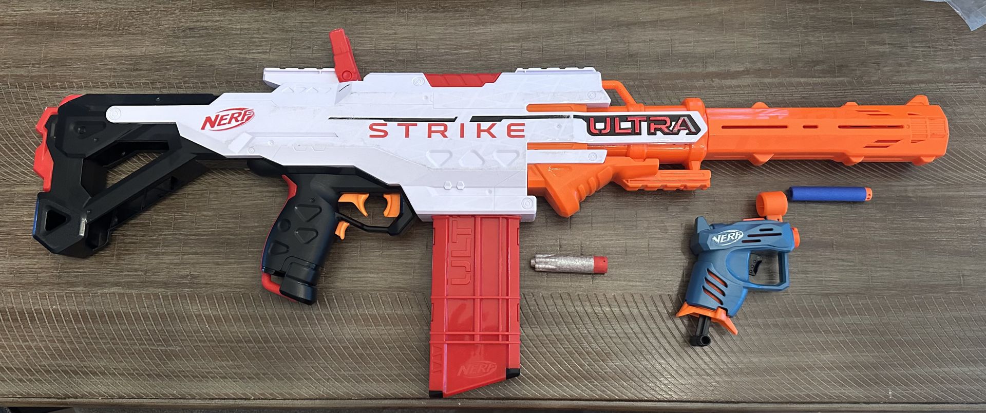 Nerf Strike Gun and small Nerf gun