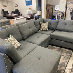 New Reversible Nailhead Sectional.  Grey.  104” X 75”.  Free Delivery!