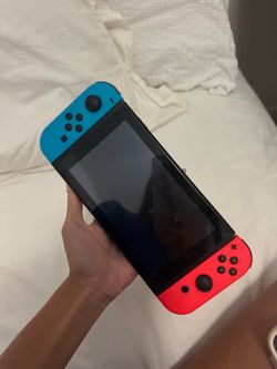 Nintendo Switch with Neon Blue and Neon Red Joy Con Gaming Console