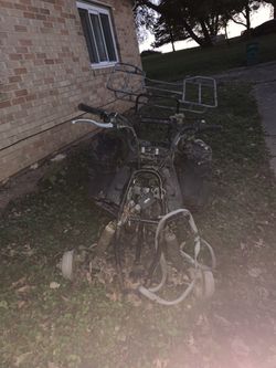 4 Wheeler. Needs Work. It Just Needs Ignition And Battery.  Camouflage Body Covers Included! Pick Up Only