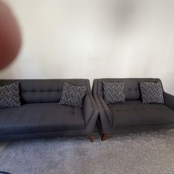 Two piece dark gray couches 