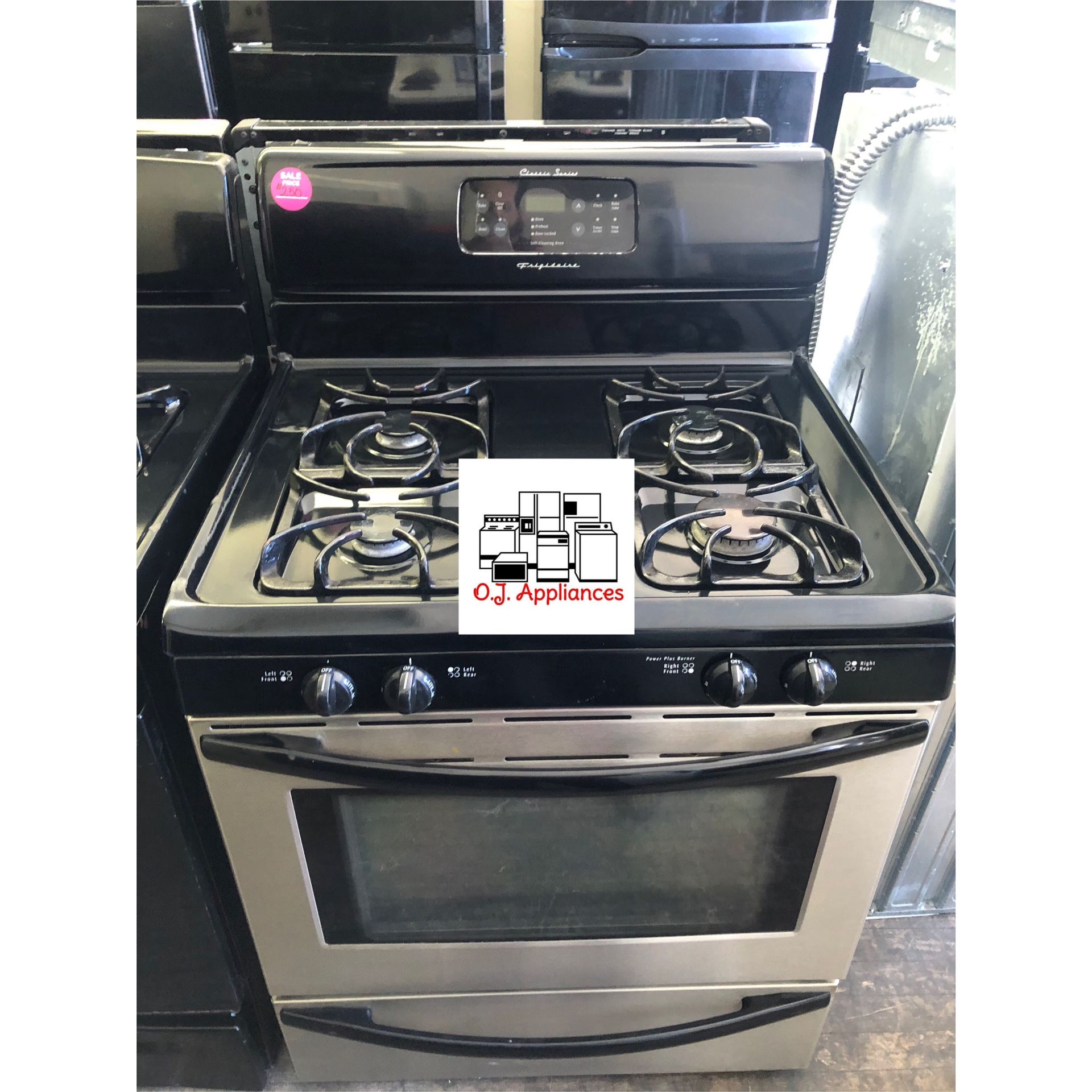 Black and stainless steel four burner Frigidaire gas