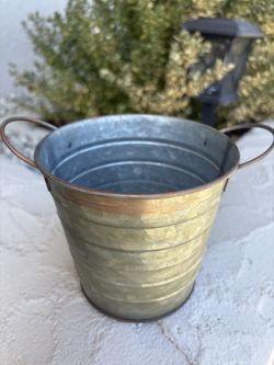 metal tub with handles is a rustic tabletop planter or farmhouse decor container