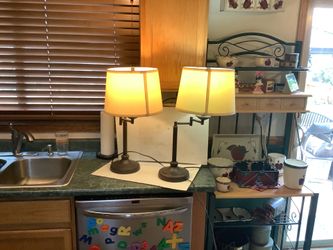 Bronze matching set of 26” swivel lamps for night stands, both in excellent condition.  Ideal for reading or to add a very classy accent piece to your