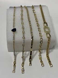 High-quality jewelry with 14k gold plating for everyday use; bracelets with various designs. From $9