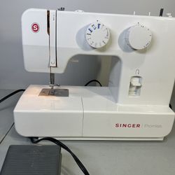 Singer Promise 1409 Electric Sewing Machine & Foot Pedal Controller (parts only) used in good condition comes as pictured and does not include anythin