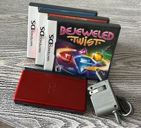 Crimson Red Nintendo DS in excellent condition with 3 games, complete with stylus & charger. $75
