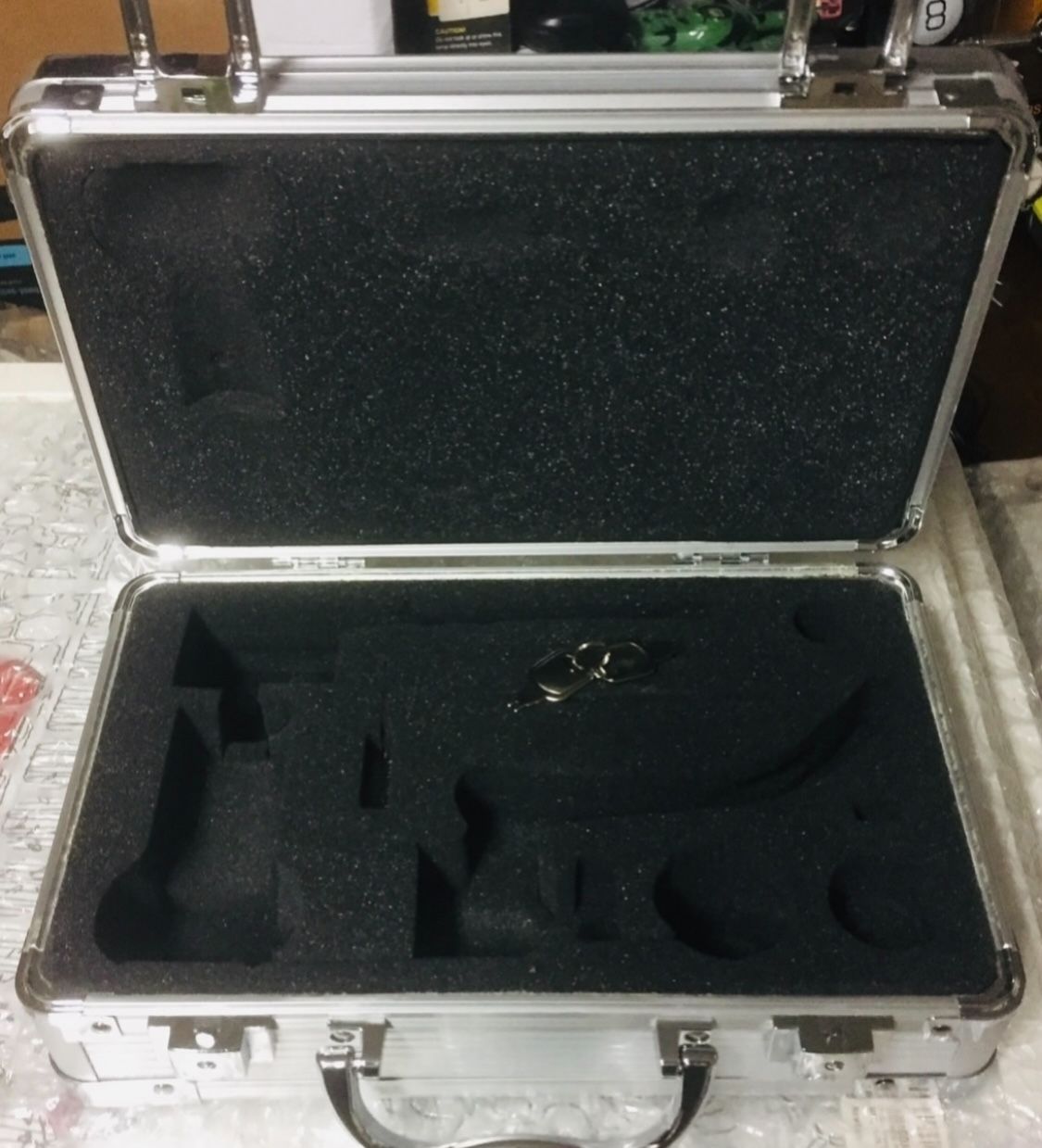 Note: Case only-in stock. Each case has a different engraved serial number. Brand new beautiful aluminum locking camera or gun case. Comes with 2 keys