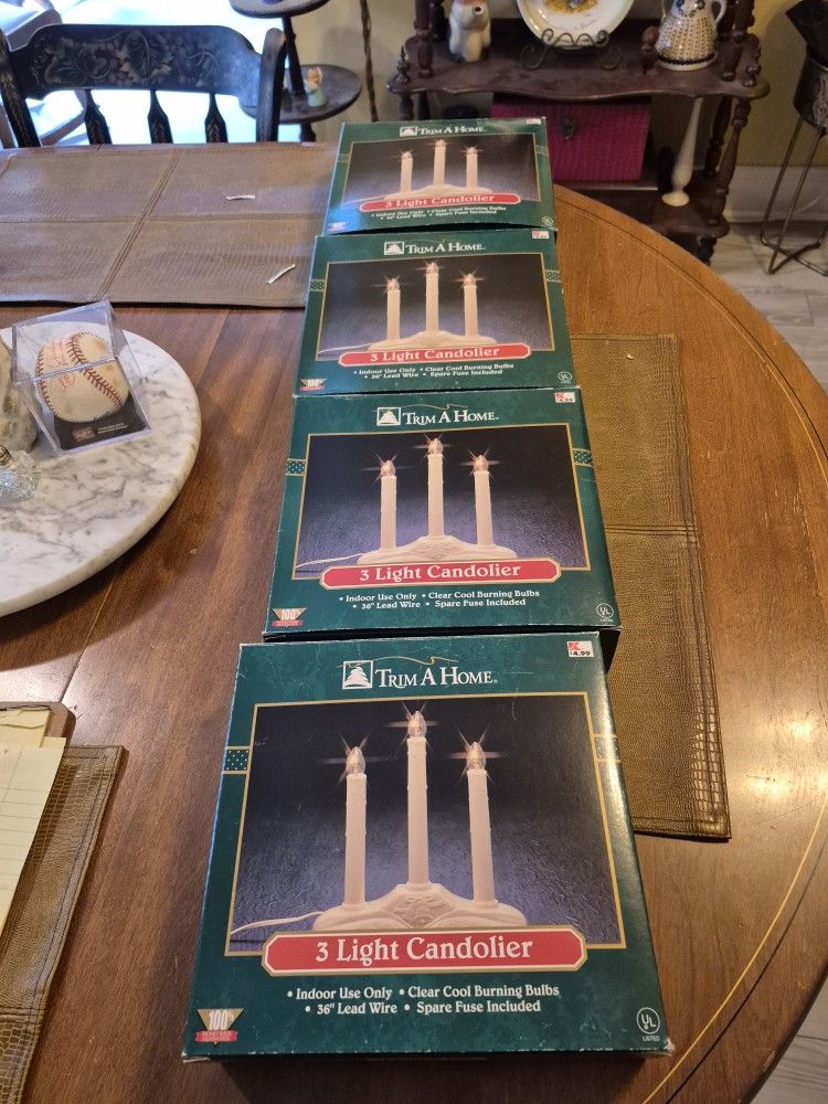Four Boxes of trim a home, three light candoliers