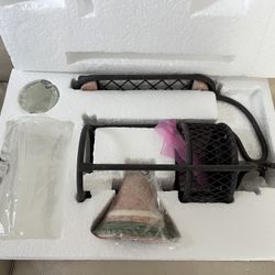 wall-mounted candle holder with a bell