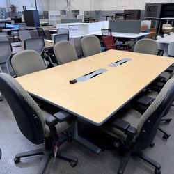 Pre owned heavy duty 8’feet x 4’1/2 feet Conference table in maple color laminate finish with seating for up to 8 people.