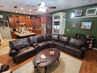 Haverty’s dark brown leather 7  piece circular couch.