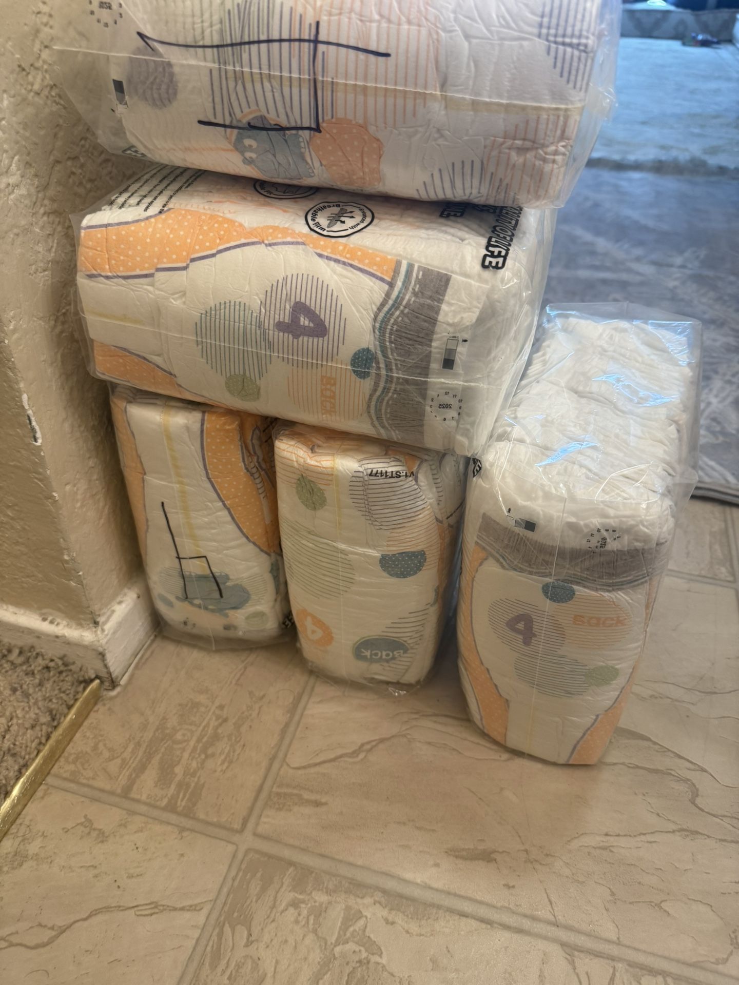 9 Packets Of Size 4 Baby Diapers