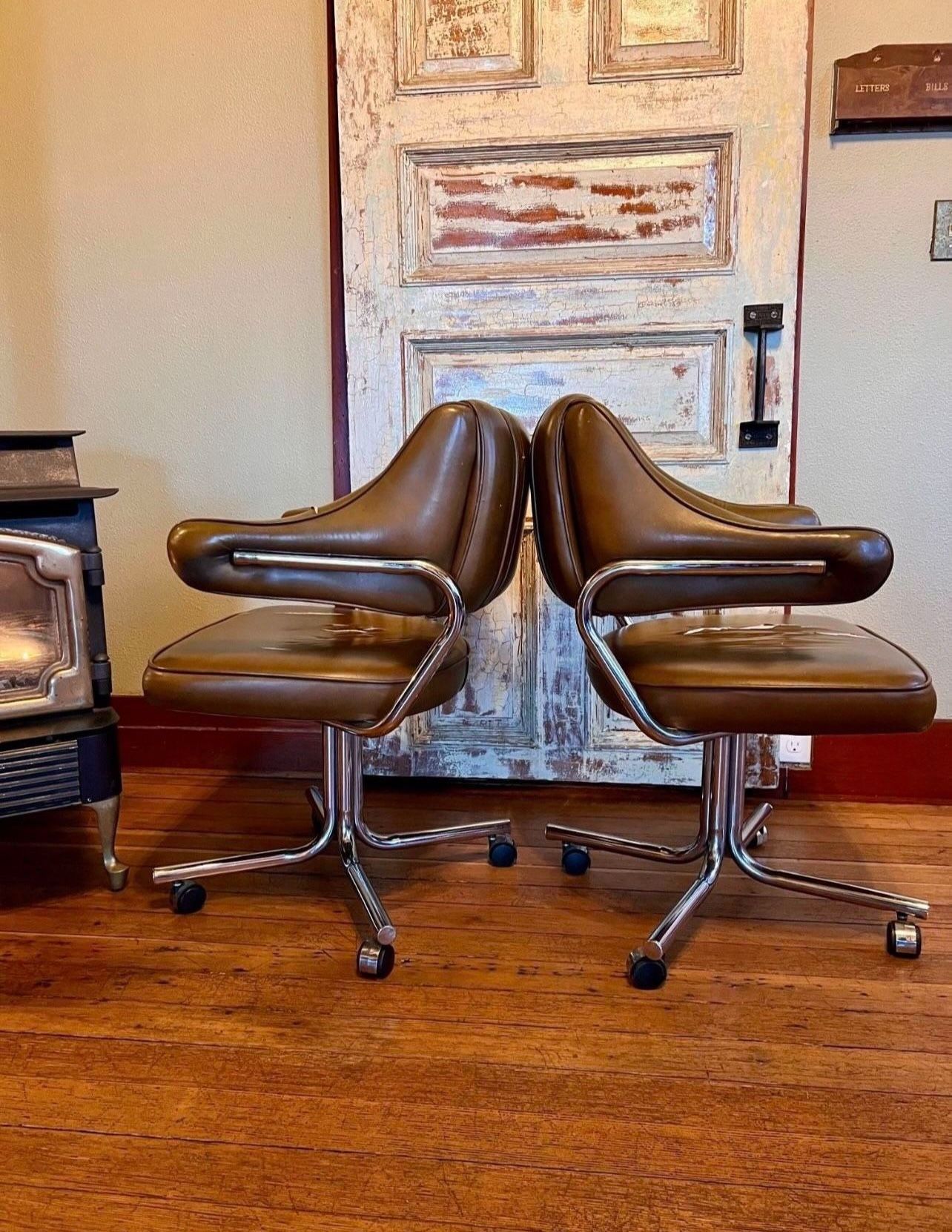 Two mid-century styled rolling chairs - Selling as a pair