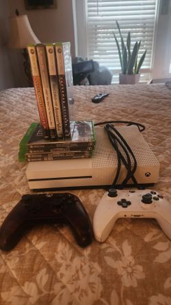 X box with 8 games and 2 controllers